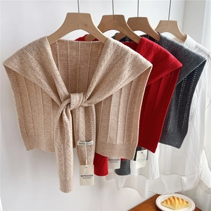Knitted shawl wrap in multiple colors featuring hollow vertical stripes and ribbed edges