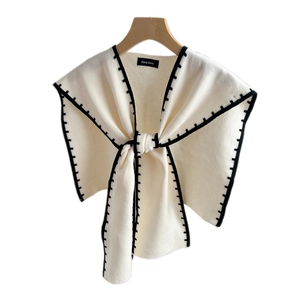 Knitted shawl collar wrap in off-white with black contrast stitching for women