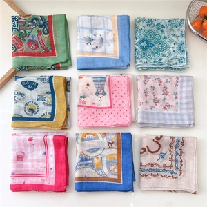 Nine diverse patterned cotton linen square scarves displayed in a 3x3 grid layout