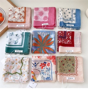Flat lay of vintage cotton linen handkerchiefs with floral and grid patterns