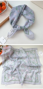 Detail view of cotton-linen square scarf with tulip print and green stitched edges