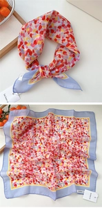 Detail of colorful cotton-linen scarf with floral patterns and original hangtag