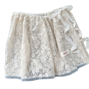 White floral lace ballet wrap mini skirt with ribbon ties and mesh texture details