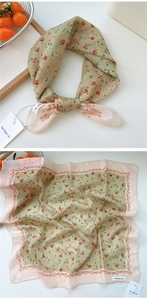 Detailed view of floral cotton linen square scarf with green and pink vintage patterns
