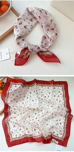 Detailed view of floral cotton linen square scarf with vintage red lace printed borders