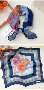 Detail of floral cotton linen square scarf with navy border and flower pattern print
