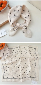 Polka dot cotton scarf detail showing folded styling and flat layout dimensions