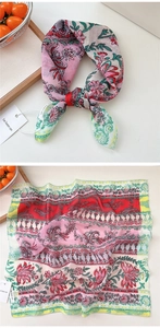 Detailed paisley floral print on pink cotton silk scarf with elegant knotted styling