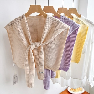 Knitted floral shoulder cape shawls in cream, purple, and yellow with rib cuffs