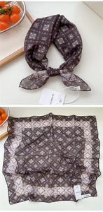 Dettaglio macro di una sciarpa quadrata in seta con stampa floreale boho marrone retro