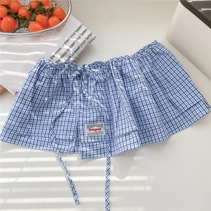 Blue and white checkered decorative skirt extender with drawstring and brand label detail