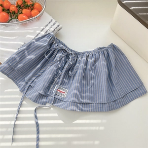 Close-up of blue and white striped shirt extender with adjustable drawstring waist and label