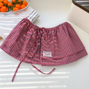 Red and blue plaid layered skirt extender with adjustable drawstring and brand label