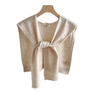 Classic beige 100% wool cable knit shawl with ribbed edges and elegant tie front design