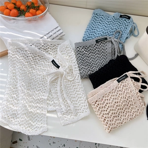 Lace-up hollow knit mini wrap skirts for layering in white blue grey black and beige