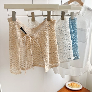 Three colors of crochet hollow knit mini skirts with lace-up waist for stylish layering