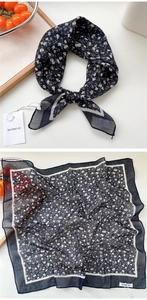 Close-up of navy blue floral cotton linen scarf with delicate white flower pattern