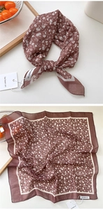 Detail of a brown floral cotton linen neckerchief with delicate white flower patterns