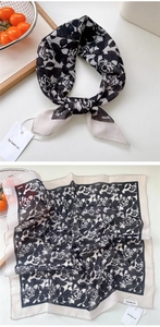 Detailed view of a black and white floral linen cotton square scarf with rose patterns