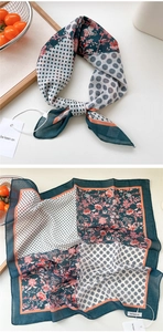 Close-up of a printed cotton linen neck scarf with patchwork floral and geometric patterns