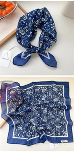 Close-up of a dark blue floral cotton-linen scarf with white small flower patterns