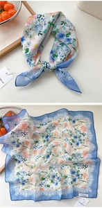 Detail of floral cotton linen square scarf with lace print border and delicate knot