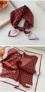 Detail of reddish-brown polka dot cotton scarf with West Lafayette lettering print