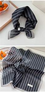Detail of 100% cotton striped square scarf showing soft texture and hemmed edges