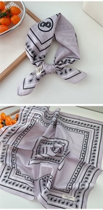 Detail of 100% cotton lavender neckerchief with classic paisley pattern and soft texture