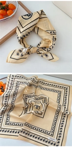 Detailed view of yellow paisley cotton scarf showing soft texture and knotting style