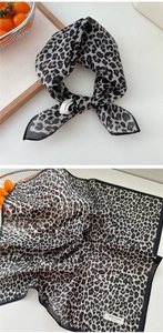 Detailed view of leopard print cotton square scarf with premium stitched edges and soft texture