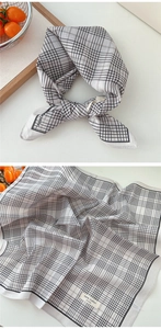 Macro detail of breathable 100% cotton checkered scarf with a vintage texture