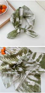 Detail of 100% cotton green marble tie-dye bandana with West Lafayette branding