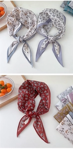 Detail eines Rauten-Schals aus 100% Baumwolle mit Blumenmuster und Stoffstruktur