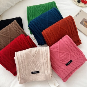 Thick knit 100% wool scarves in various solid colors with classic cable pattern