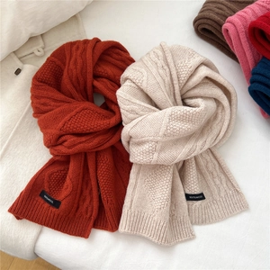 Thick cable knit 100% wool scarves in orange and beige with chunky texture