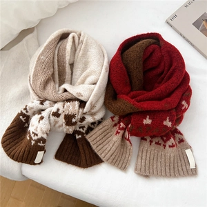 Long knit winter scarf with ribbing and jacquard patterns in beige and red colors