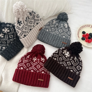 Women winter knit beanie set with snowflake patterns and pom poms in multiple colors