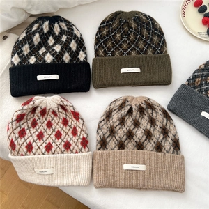 Women's warm winter knit beanies with argyle patterns and stylish woven labels