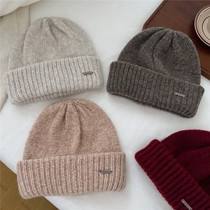 Chunky knit winter hats for women in four neutral colors with metallic accents