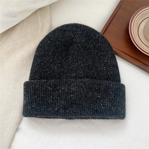 Detail of dark grey marl knit beanie with thick wool texture and folded cuff design