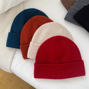 Solid color knitted wool beanies for women in multiple warm winter colors and soft texture