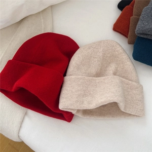 Solid color knit wool beanie for women in various warm winter colors and soft fabric