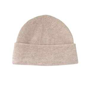 Solid oatmeal knit wool beanie with classic cuffed design for winter warmth and comfort