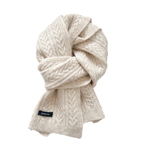 Minimalist beige wool blend cable knit scarf for winter featuring a brand logo woven label