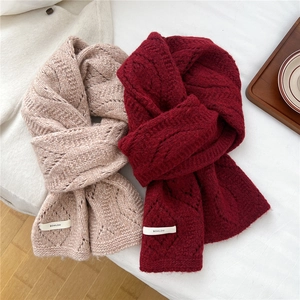 Oatmeal and burgundy chunky cable knit wool blend scarves in a cozy winter style