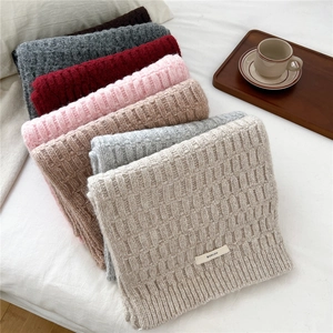 Thick wool blend knitted scarves in assorted winter colors with waffle pattern texture