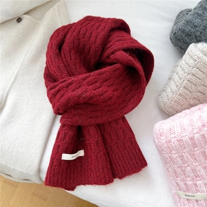 Knitted wool blend scarf in deep wine red color with waffle pattern and brand label