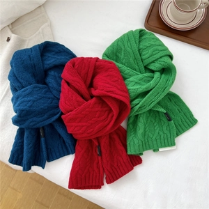 Thick cable knit wool scarves in blue, red, and green colors for winter warmth
