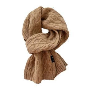 Camel cable knit wool scarf for women with 100% wool label on white background